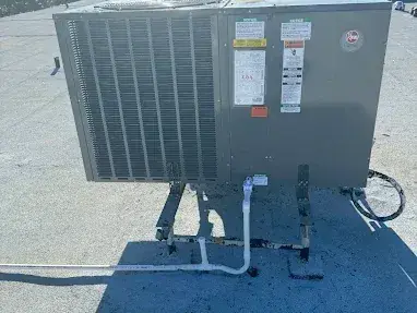 New packaged unit installed on a flat commercial roof