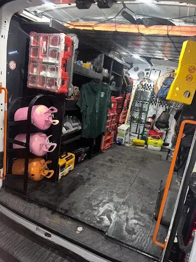 Inside a Service Shield service van, stocked with refrigerant, parts and tools